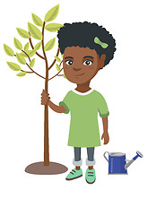 Image showing African-american smiling girl planting a tree.