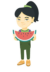 Image showing Young asian girl eating delicious watermelon.