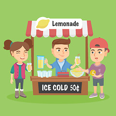 Image showing Little caucasian kid selling lemonade.