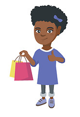 Image showing Happy african-american girl holding shopping bags.