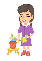 Image showing Caucasian girl watering plant with a watering can.