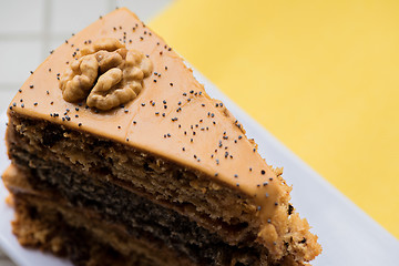 Image showing A piece of cake with condensed milk on a plate