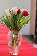 Image showing A bouquet of tulips in a vase on the table