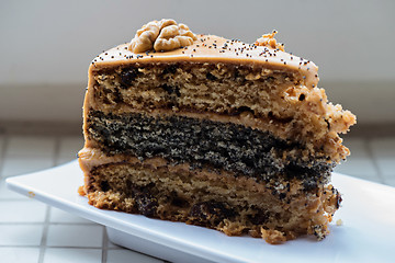 Image showing A piece of cake with condensed milk on a plate