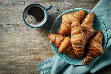 Image showing freshly baked croissants and coffee