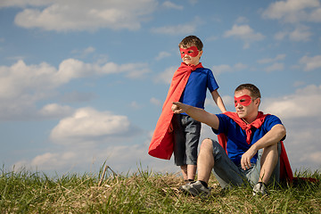 Image showing Father and son playing superhero at the day time.