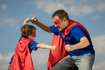 Image showing Father and son playing superhero at the day time.