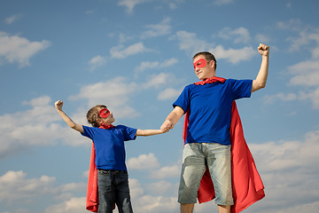 Image showing Father and son playing superhero at the day time.