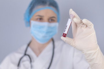 Image showing Nurse holding test tube blood sample