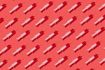 Image showing Medicinal pattern from syringes with red liquid or serum.