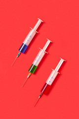 Image showing Therapeutic set of sterile plastic syrenges with colorful vaccines.