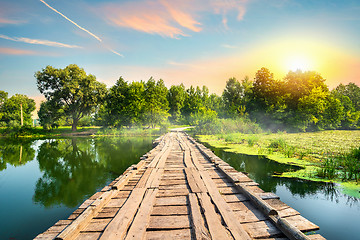 Image showing Wooden bridge at sunset