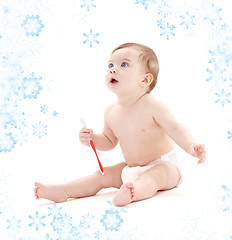 Image showing baby boy in diaper with toothbrush