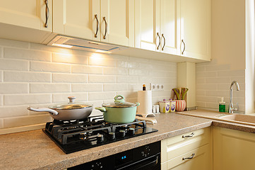 Image showing closeup of modern cream colored kitchen interior