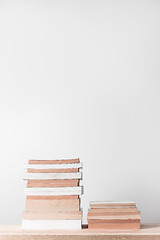 Image showing Stacks of books on a wooden shelf