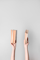 Image showing Female hands holding books