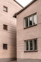 Image showing Two stone pastel colored buildings