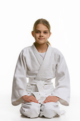 Image showing Girl in judo class, sitting on the floor