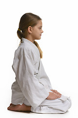 Image showing Judo student sits on the floor, view from the side