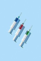 Image showing Therapeutic set of plastic syrenges with colorful vaccines.