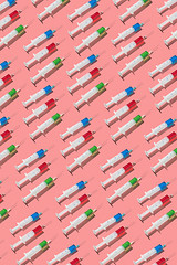 Image showing Health pattern of disposable syringes with colored drugs.