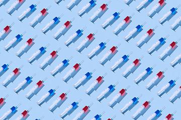 Image showing Medicinal pattern from syringes with red and blue serum.