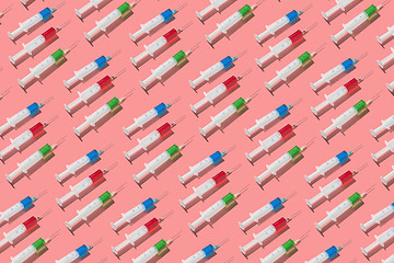 Image showing Therapeutic pattern of plastic syrenges with colorful vaccines.