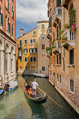 Image showing Venice, Italy. Tourists riding gondolas