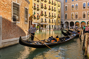 Image showing Venice, Italy. Tourists riding gondolas