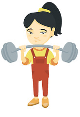 Image showing Upset asian girl lifting heavy weight barbell.