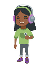 Image showing African girl listening to music in headphones.