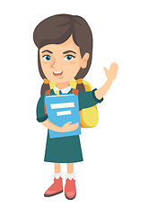 Image showing Schoolgirl holding a book and waving her hand.