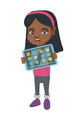 Image showing African girl playing game on a tablet computer.