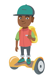 Image showing African schoolboy riding on gyroboard to school.