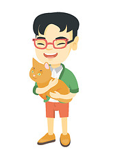 Image showing Asian happy boy  holding a cat.