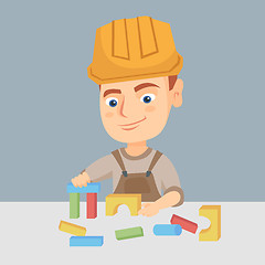 Image showing Boy playing in the builder with building cubes toy