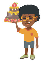 Image showing Little african boy holding a chocolate cake.