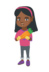 Image showing African-american girl holding fresh carrot.