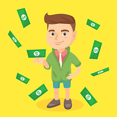 Image showing Little caucasian boy standing under money rain.