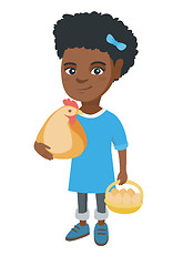 Image showing African girl holding a chicken and hen eggs.