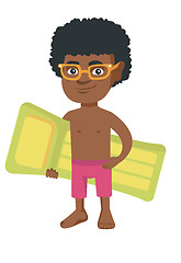 Image showing Little african boy holding inflatable mattress.