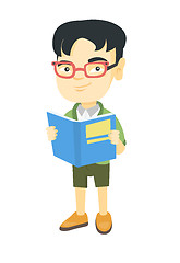 Image showing Little asian schoolboy reading a book.