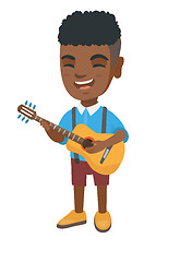 Image showing African boy singing and playing acoustic guitar.