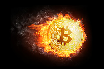 Image showing Golden bitcoin coin flying in fire flame.