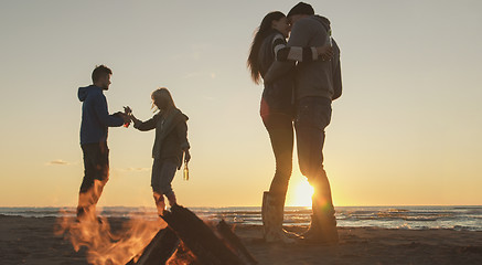 Image showing Friends having fun at beach on autumn day