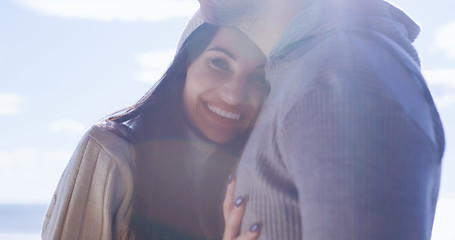 Image showing Couple having fun on beautiful autumn day at beach