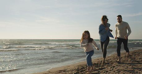 Image showing Young family enjoying vecation during autumn