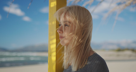 Image showing Young woman enjoying the warm autumn day