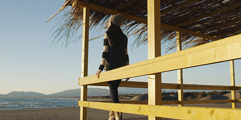 Image showing Young woman enjoying the warm autumn day