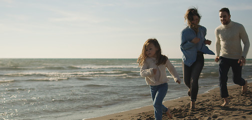 Image showing Young family enjoying vecation during autumn